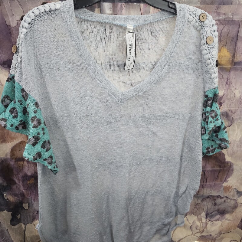 Baby blue light weight sweater with minty green leopard print sleeves