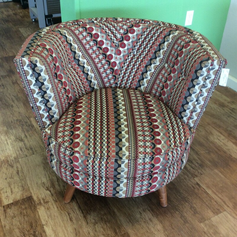 Personality and charm is built in to this modern style swivel barrel chair.  Upholstered in a multicolor fabric seated on wood legs, Size: 36\"