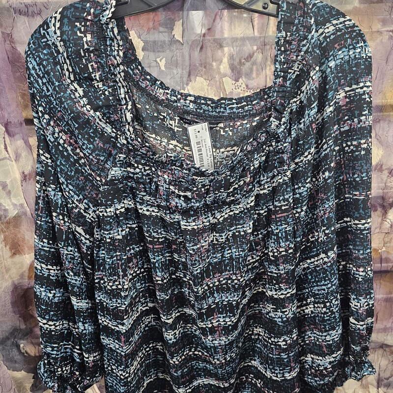 Half sleeve blouse in black with teal, burgandy and white print.