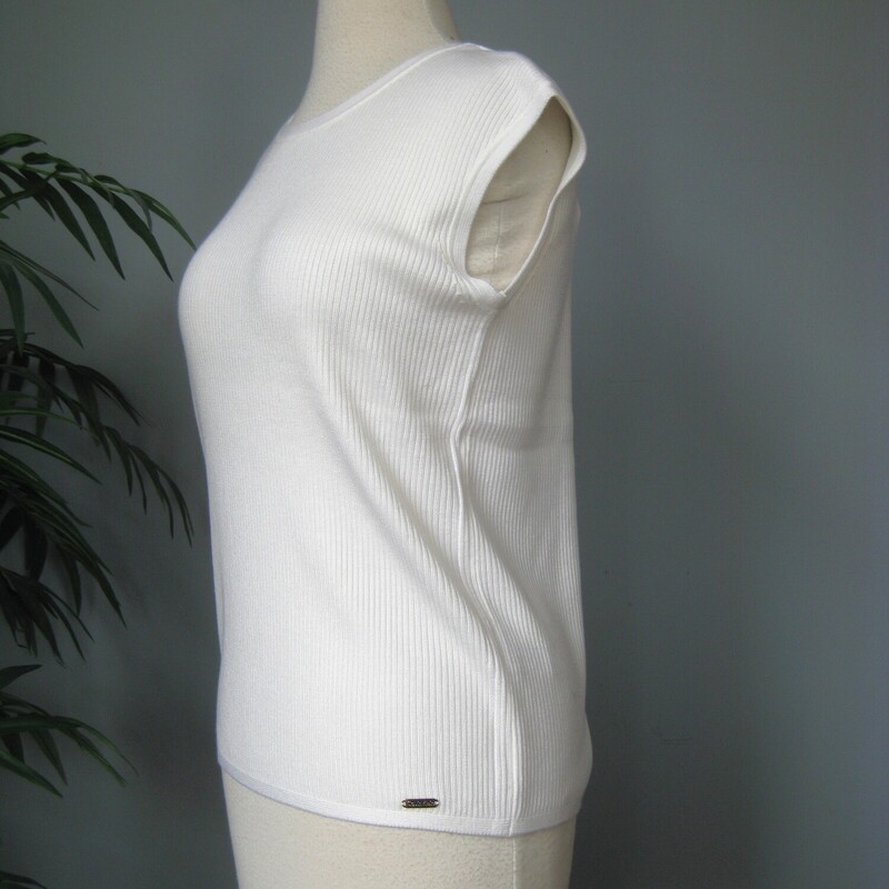 NWT Calvin Klein Slvless, White, Size: Medium
Simple wardrobe staple From Calvin Klein
Brand new with tags attached.
White ribbed knit
100% acrylic - stretchy
Size M

Here are the flat measurements, please double where appropriate:
Armpit to armpit: 17
Width at Hem: 17
Length: 23

Excellent brand new  condition, no flaws.

Thanks for looking
#69760