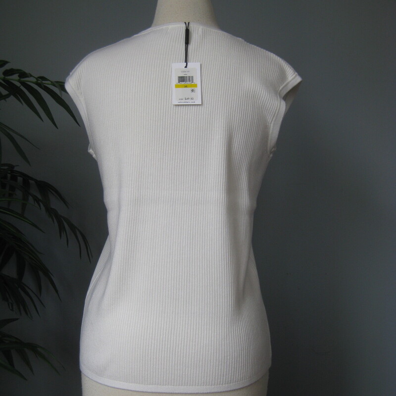 NWT Calvin Klein Slvless, White, Size: Medium<br />
Simple wardrobe staple From Calvin Klein<br />
Brand new with tags attached.<br />
White ribbed knit<br />
100% acrylic - stretchy<br />
Size M<br />
<br />
Here are the flat measurements, please double where appropriate:<br />
Armpit to armpit: 17<br />
Width at Hem: 17<br />
Length: 23<br />
<br />
Excellent brand new  condition, no flaws.<br />
<br />
Thanks for looking<br />
#69760