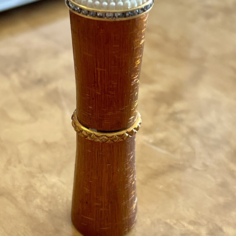 Van Cleef & Arpels Revlon Futurama Lipstick Case  with brushed bamboo look with Rhinestone & Pearl top. c..1950s. Still has original booklet rolled up inside & has never been used. 2 7/8 inch<br />
Will ship USPS Priority.