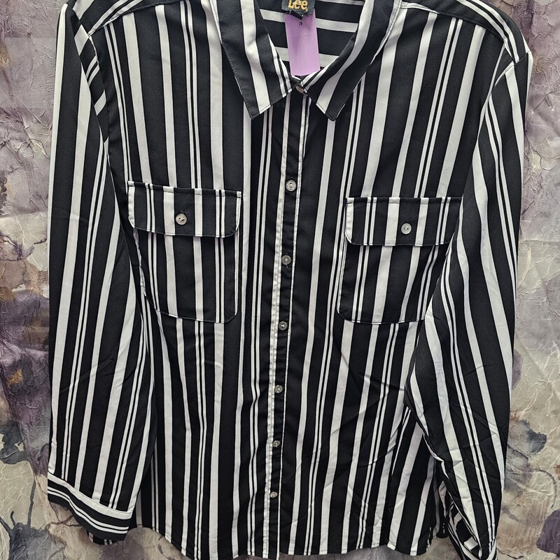 Black and white printed blouse with button up front.