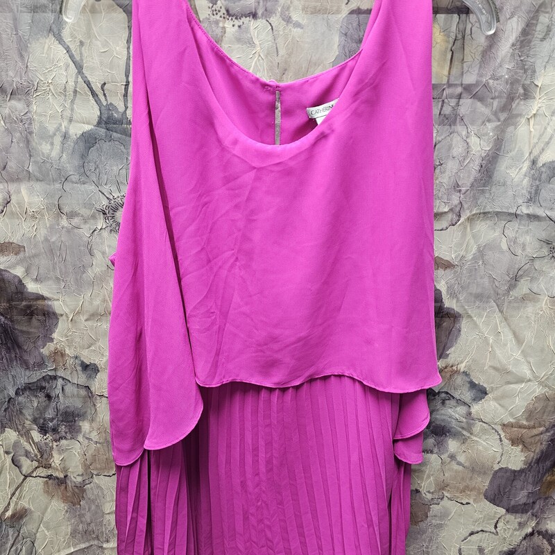 Beautiful pink sleeveless blouse with pleated under layer and a top faux shawl layer to flatter any figure.
