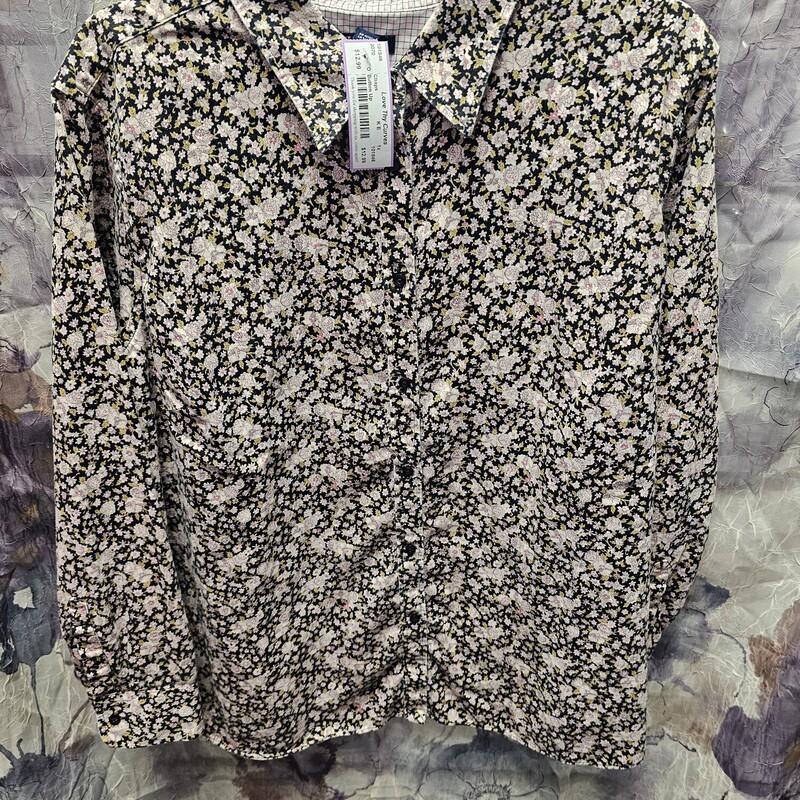 Long sleeve button up blouse in black with green and pink floral print.