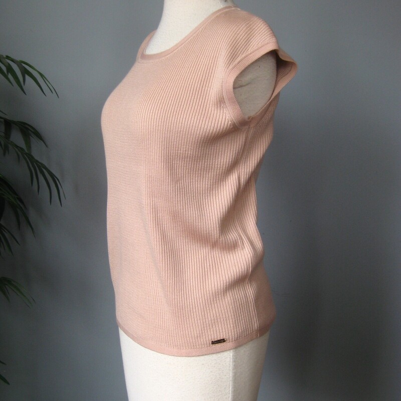 NWT Calvin Klein Knit, Pink, Size: Medium<br />
Simple wardrobe staple From Calvin Klein<br />
Brand new with tags attached.<br />
Cool tone pale pink ribbed knit<br />
100% acrylic - stretchy<br />
Size M<br />
<br />
Here are the flat measurements, please double where appropriate:<br />
Armpit to armpit: 17<br />
Width at Hem: 17<br />
Length: 23<br />
<br />
Excellent brand new  condition, no flaws.<br />
<br />
Thanks for looking<br />
#69772