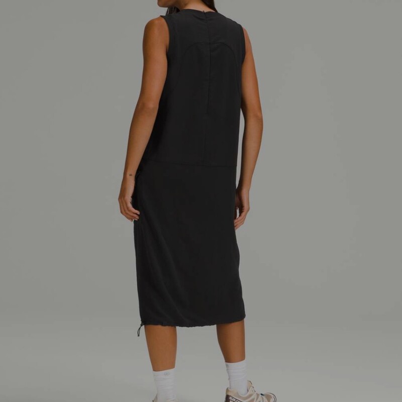 Lululemon Pocketed Drop-Waist Midi Dress. Worth $138. Softly textured fabric is quick-drying, drapey and lightweight with a relaxed fit. Cinchable hem, side pockets, and a hidden pocket. In excellent pre-loved condition! Colour: Black, Size: 10