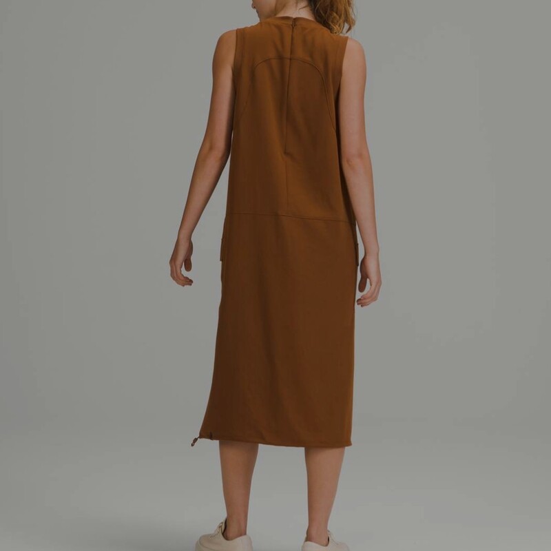 Lululemon Pocketed Drop-Waist Midi Dress. Worth $138. Softly textured fabric is quick-drying, drapey and lightweight with a relaxed fit. Cinchable hem, side pockets, and a hidden pocket. In excellent pre-loved condition! Colour: Copper Brown, Size: 10