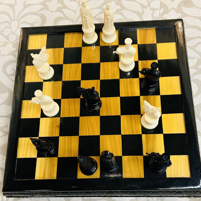 Chess Board And 32 Pieces
Black White Yellow
Size: 15.75  Square
Under side opens to store chess pieces
