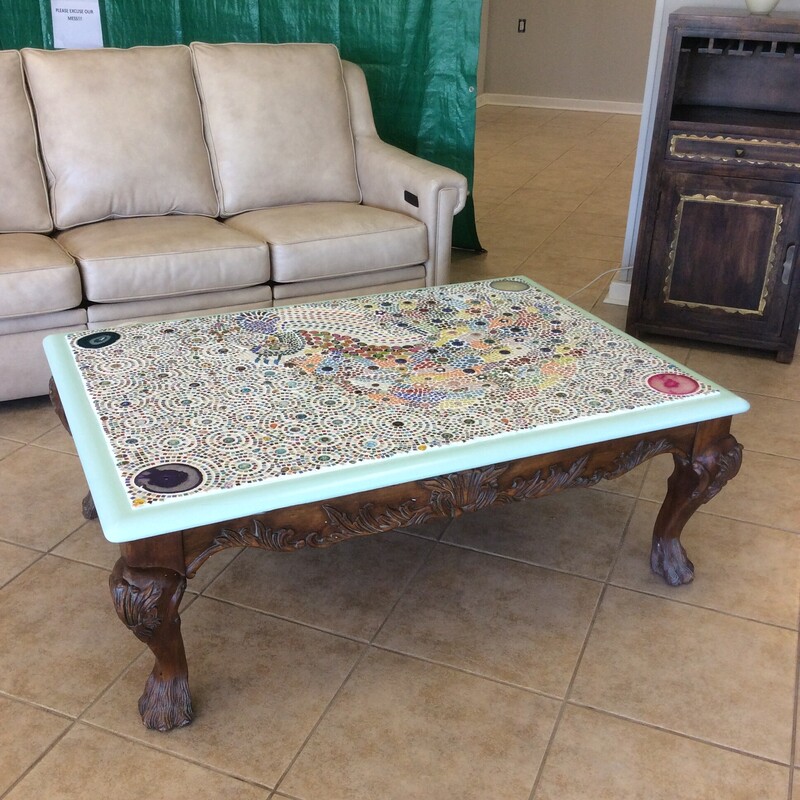 This is an interesting large coffee table with a mosaic tabletop.