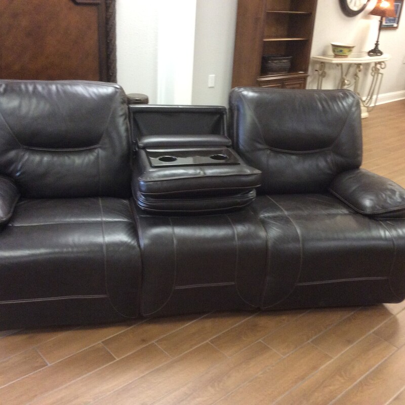 Dark brown leather electric reclining sofa.  With the option to fold down the middle seat to make room for refrechments.  Size: 95\"