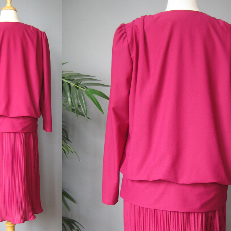 Vtg Miss Classic Gown, Raspberr, Size: 14<br />
Deep raspberry pink evening dress from the 1980s by Miss Classic<br />
It has big shoulder pads, a pleated skirt with lettuce hem and a pretty sequined flowers at the dropped waist<br />
The dress has a layered effect, appearing to have a jacket over the bodice but it is all one piece.<br />
No closures.<br />
<br />
Made in the USA<br />
Marked size 14<br />
<br />
Here are the flat measurements, please double where appropriate:<br />
Shoulder to shoulder: 16<br />
Armpit to Armpit: 20.5<br />
Waist: 21<br />
Hips: 22.5<br />
Length from back of neck to hem: 47.5<br />
Underarm sleeve seam: 18<br />
<br />
Excellent condition, no flaws!<br />
Thank you for looking.<br />
#62834