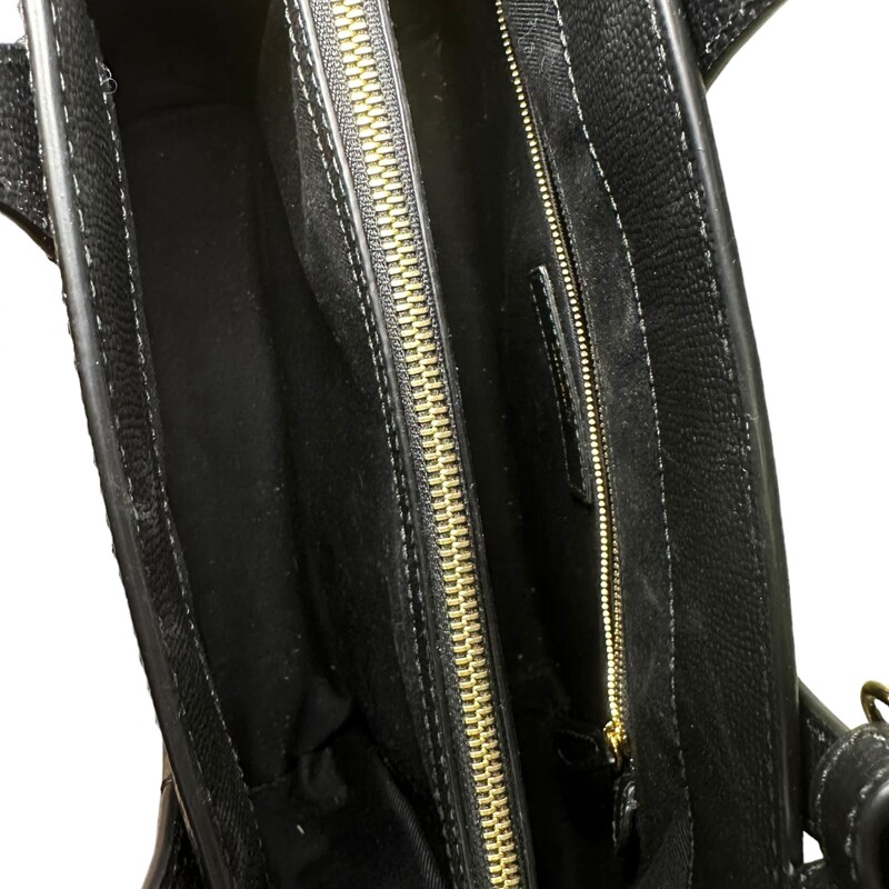 Burberry Banner Tote Black<br />
<br />
Size: Medium<br />
<br />
Dimensions:<br />
Length: 13 in<br />
Height: 9.25 in<br />
Width: 6 in<br />
Drop: 4 in<br />
Drop: 18 in<br />
<br />
Note: Wear on right corner bottom.<br />
<br />
This is an authentic Burberry Grainy Calfskin House Check Medium Banner Tote in Black. This stylish tote is crafted of finely grained calfskin leather in black with classic house check side panels. The bag features rolled leather top handles with side belts, an optional leather shoulder strap, and silver hardware. The top opens to a partitioned house check fabric interior with a center zipper pocket, side zipper pocket, and patch pockets.