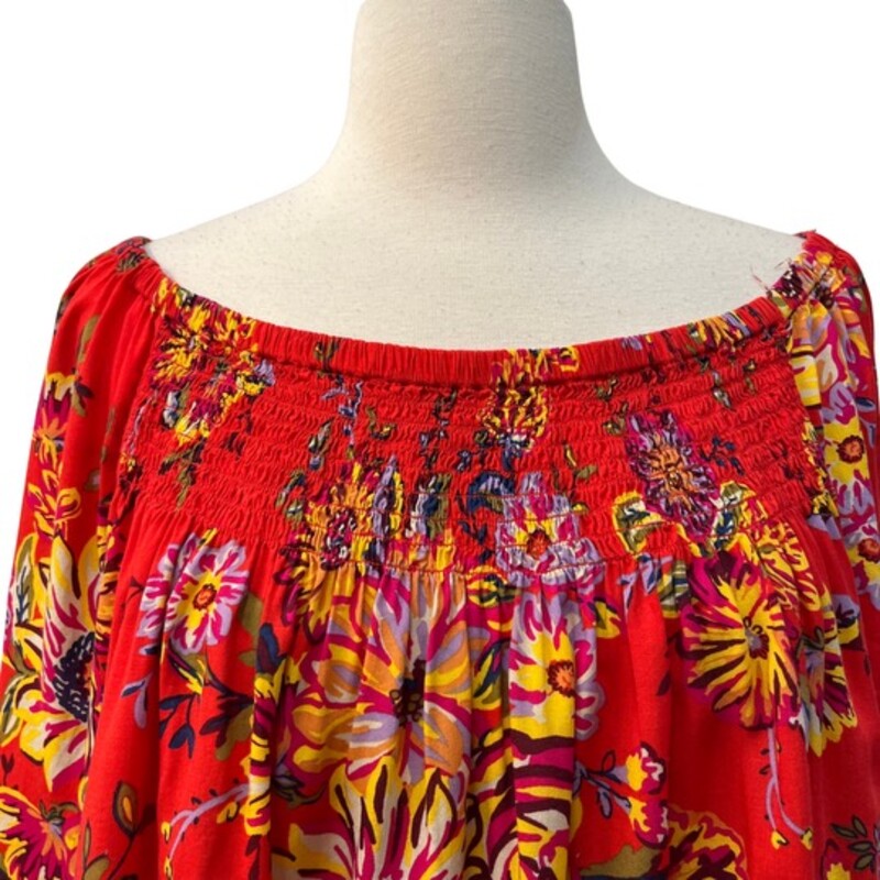BeachLunchLounge Top<br />
Bell Sleeve Detail<br />
Smocking across the Top<br />
Red with a Rainbow of Colors<br />
Size: 1XL
