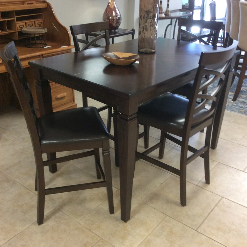 Pub Height dining table in a espresso finish, with a  butterfly leaf.  Comes with 4 padded chairs.  Size: 54x36x36