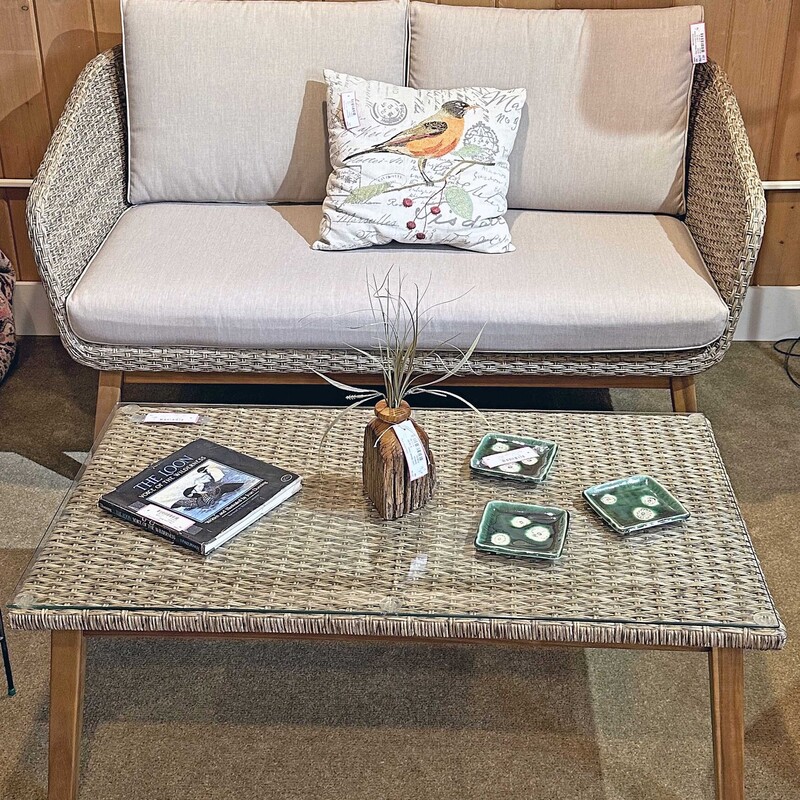Faux Wcker Lovseat W/Cushions
Size: 56x25x30
Beige faux wicker with wooden legs.  The loveseat comes with 2 cushions. There are two matching chairs sold separately.  In addition, there is a matching coffee table all sold separately.. Great addition to your sunporch.  Initially bought at Ipolitos.