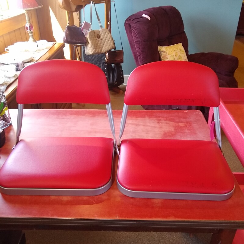 2 Red Stadium Seats, None

Cushioned stadium seats with carrying handles and hooks to secure to benches.