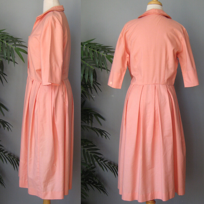 V Vtg Sears Knit House, Peach, Size: Medium<br />
Shirt dress from the 1970s in a creamsicle orange cotton or cottong blend.<br />
It buttons all the way open, fitted at the waist, short sleeves, full pleated skirt<br />
<br />
Unlined<br />
<br />
No size tag but should fit a medium generously, perhaps a large, use the measurements below to be sure!<br />
<br />
Flat measurements:<br />
Shoulder to shoulder: 17<br />
armpit to armpit: 20<br />
Waist: 16<br />
Hip: 25<br />
Length: 43<br />
<br />
Excellent condition.<br />
<br />
Thanks for looking!<br />
#67173