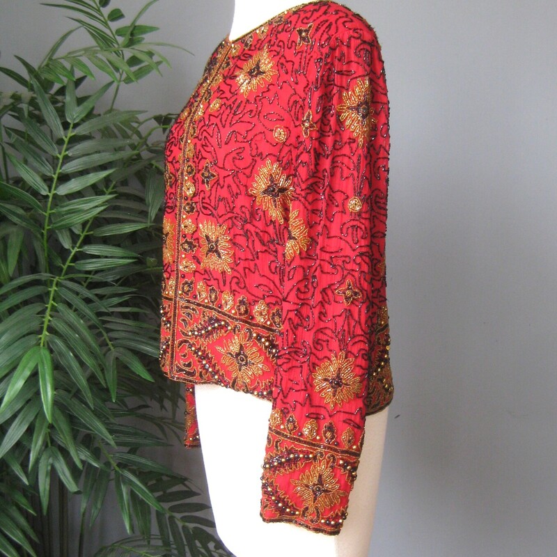 Vtg A. Papell Beaded, Red/blk, Size: Medium<br />
fabulous sequined jacket from Papell Boutique Evening<br />
Red silk opulently beaded with black, gold and red beading in an abstract design.<br />
Single hook and eye closure at the neck.<br />
made in India<br />
Excellent condition with a minor bead loss in high friction areas, like where the sleeve rubs against the body.<br />
Size Medium<br />
Shoulder to shoulder: 16.25<br />
armpit to armpit: 19.75<br />
length: 21<br />
width at hem: 19.5<br />
underarm sleeve seam: 16<br />
<br />
thanks for looking!<br />
#69165