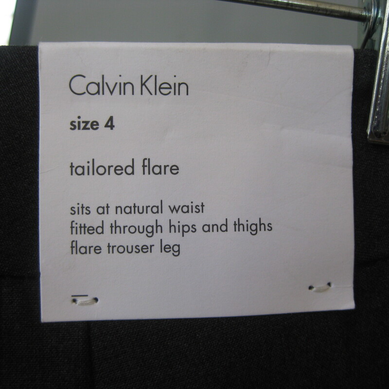Smart wardrobe staple.<br />
Calvin Klein trousers in gray with a bit of flare.<br />
Size 4<br />
pockets in the front and the back.<br />
unlined<br />
flat measurements:<br />
waist: 15.75<br />
hip: 20<br />
rise: 10.5<br />
inseam: 33<br />
side seam: 42.5<br />
<br />
brand new with tags.<br />
thanks for looking!<br />
#70702