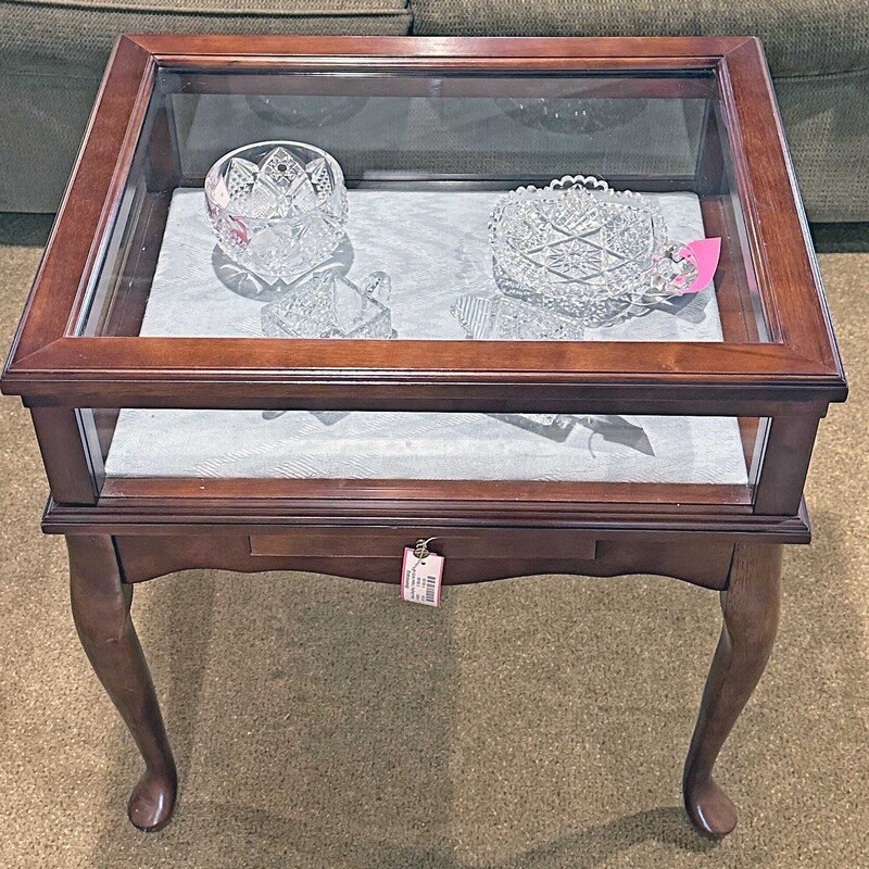 Glass Display Table W/Drw,
 Size: 23x17x23
Great piece to display all your favorite possessions.  The top lifts for easy access and there is a drawer.  Great piece for the consummate collector!!