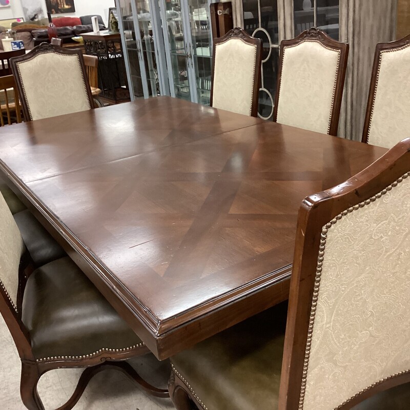 Dk Wd Table+8 Ch+2 Leaves, Dk Wood, Leather Chairs
93in x 52in x 30in tall
two 22in leaves
