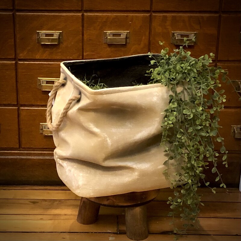 Introducing the Ceramic Slouch Planter - the epitome of urban chic and a must-have for every trendsetter's green oasis! This planter isn't just for your leafy buddies; it's a bold statement piece that marries raw industrial vibes with modern elegance. Super cool piece, looks like fabric but is actually a full working ceramic planter!<br />
14 H x 15 L x 10 D