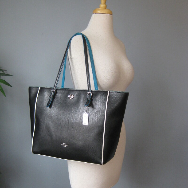 Coach Pebbled Tote, Black, Size: None<br />
Coach Edgestain black carryall tote in black pebble leather with teal accents and teal interior.<br />
top zipper<br />
big side pocket<br />
2 slip and one zip pocket inside<br />
No C1657-38323<br />
great condition with a touch of darkening of the white edges and a white mark on the outside.  Pls see all the photos.<br />
<br />
12.5 wide at bottom, 18 wide at the top<br />
11.5 tall<br />
6 deep<br />
handle drop: 9.5<br />
<br />
thanks for looking!<br />
#71500