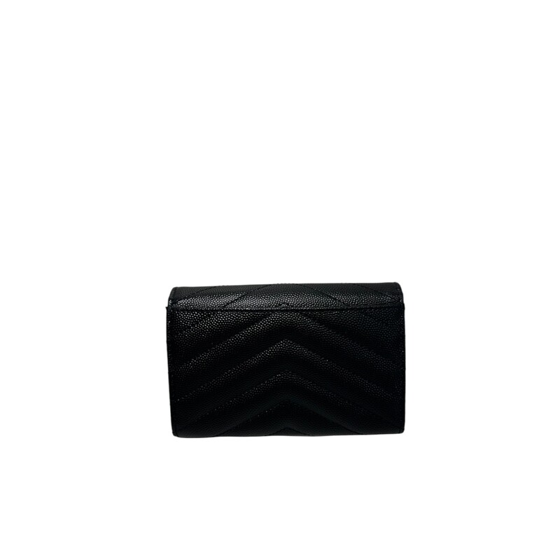 YSL Cassandre WAllet<br />
SMALL WALLET WITH FLAP DECORATED WITH THE CASSANDRE AND QUILTED OVERSTITCHING.<br />
<br />
 DIMENSIONS:  5.3 X 3.7 X 1.1 INCHES<br />
 GOLD-TONED METAL HARDWARE<br />
 SNAP BUTTON CLOSURE<br />
 EXTERIOR: ONE REAR FLAT POCKET<br />
 INTERIOR: FOUR CARD SLOTS, ONE OPEN COMPARTMENT<br />
 LEATHER LINING<br />
 LAMBSKIN<br />
 STYLE ID 414404AAA441000<br />
 MADE IN ITALY