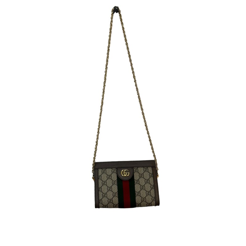 Crafted in GG Supreme canvas with inlaid Web stripe detail, the chain strap shoulder bag boasts a vintage inspired design. The structured shape secures with a magnetic closure, trimmed with leather and Double G hardware—an archival detail.
Gucci Ophidia chain Bag
Beige/ebony GG Supreme canvas, with brown leather trim
Green and red Web
Gold-toned hardware
Double G
Two compartments
Interior open pocket
Chain shoulder strap with 16.9 drop
Magnet closure
Dimensions: W 7.5 x 5.9