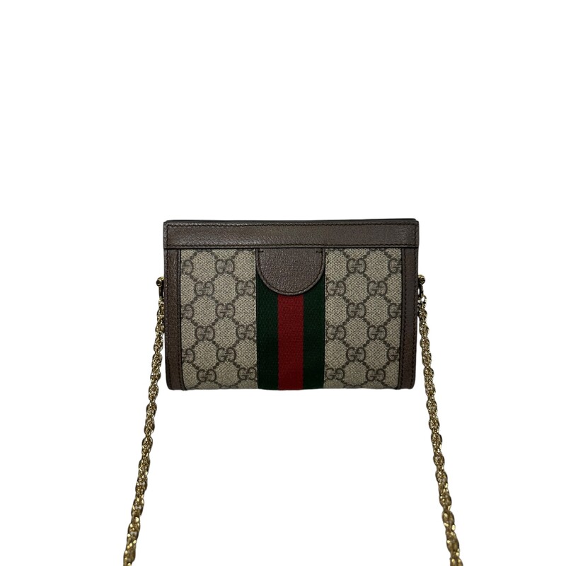 Crafted in GG Supreme canvas with inlaid Web stripe detail, the chain strap shoulder bag boasts a vintage inspired design. The structured shape secures with a magnetic closure, trimmed with leather and Double G hardware—an archival detail.<br />
Gucci Ophidia chain Bag<br />
Beige/ebony GG Supreme canvas, with brown leather trim<br />
Green and red Web<br />
Gold-toned hardware<br />
Double G<br />
Two compartments<br />
Interior open pocket<br />
Chain shoulder strap with 16.9 drop<br />
Magnet closure<br />
Dimensions: W 7.5 x 5.9