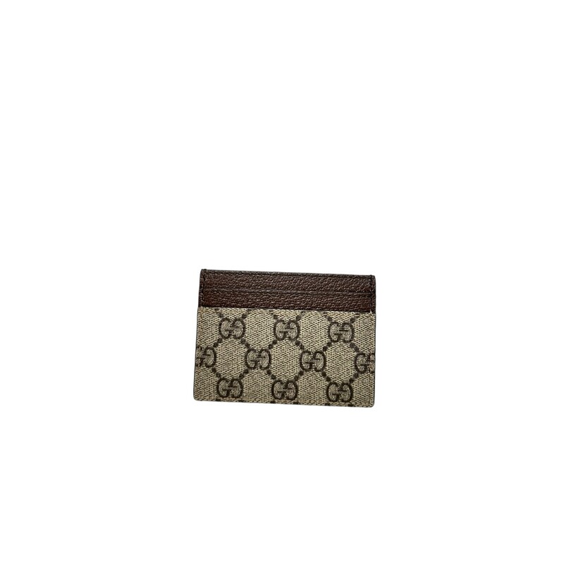 Gucci Ophidia GG<br />
Beige/ebony GG Supreme canvas, with brown leather trim<br />
Green and red Web<br />
Gold-toned hardware<br />
Double G<br />
Four card slots, one open pocket<br />
4W x 3H<br />
Made in Italy