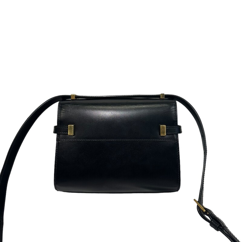 Saint Laurent Manhattan Black Mini<br />
<br />
Dimensions:<br />
19 X 14 X 4 cm/ 7.4 X 5.5 X 1.5 inches<br />
<br />
Note: Light scratching on the outside<br />
<br />
Magnetic clip buckle compression closure<br />
Brozne-toned metal hardware<br />
Leather<br />
Interior: One Main Compartment, One Card Slot