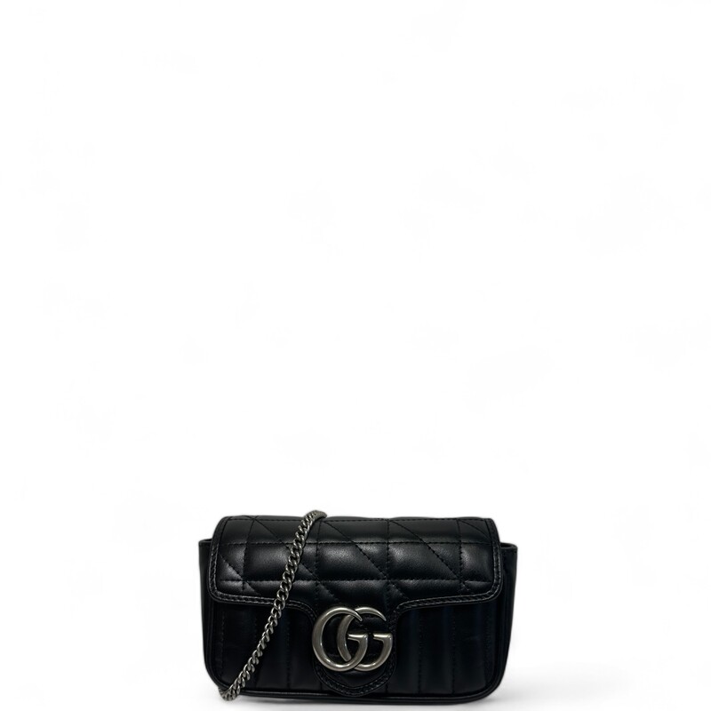 Gucci Marmont Shoulder, Black, Size: Super Mini

Dimensions:
Length: 6.5 in
Height: 4.25 in
Width: 7.75 in
Drop: 23 in

This is an authentic Gucci Calfskin Matelasse Aria Super Mini GG Marmont Shoulder Bag in Black. This shoulder bag is crafted of black calfskin leather. This crossbody bag features an aged silver chain shoulder strap. The front crossover flap features an aged silver GG logo that opens to a light beige suede interior.