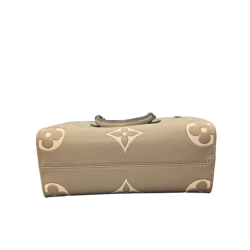 Louis Vuitton OnTheGo, Cream, Size: PM<br />
<br />
Dimensions:<br />
9.8 x 7.5 x 4.5 inches<br />
(length x Height x Width)<br />
<br />
This is an authentic Louis Vuitton Empreinte Monogram Giant Onthego PM in Cream and Beige. This limited edition tote features oversized versions of the classic Louis Vuitton monogram leather in black. The bag features black leather top handles and an optional adjustable shoulder strap. The top opens to a spacious red microfiber interior with zipper and patch pockets.
