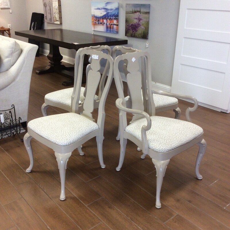 This set of 4 diningroom chairs are a little shabby, maybe a little farmhousy. The frame has been painted  taupe and distressed for that weathered, timeless, shabby look. The seats have been upholstered in a matching colored animal print.
Very cute.