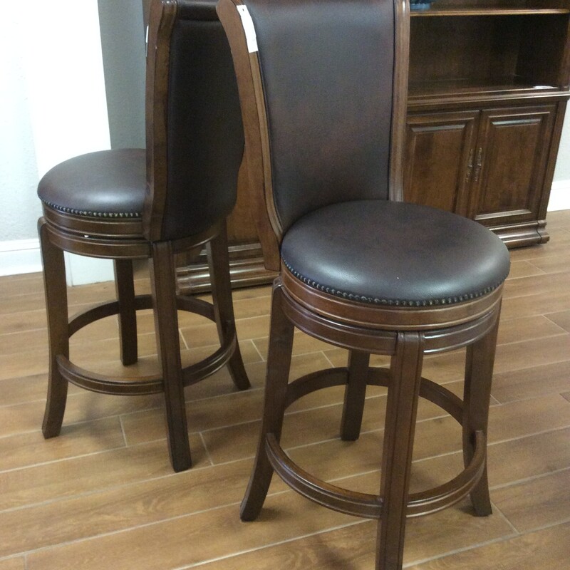 This pair of counter height barstools are very nice.
They swivel and have a nailhead trim.