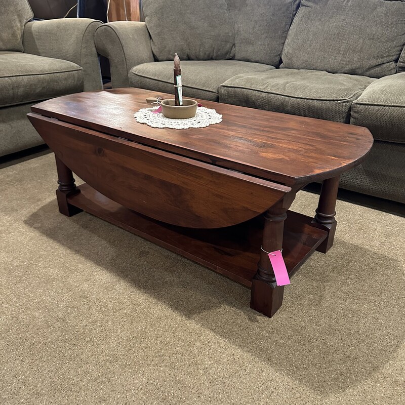 Wood Drop Leaf Coffee Tbl,
 Size: 24x20x16 each leaf is 9 inches

Great size for a small space!  Solid wood table with
a shelf under.  The finish on the top needs a little attention, otherwise this is a great piece for the $$.