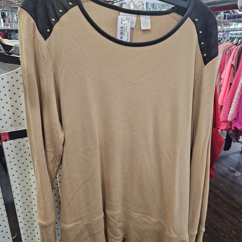 Long sleeve knit top in tan with black faux leather shoulders with studding.