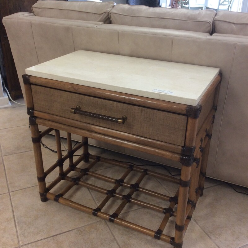 This attractive end table is from the Home Surroundings Collection from Tommy Bahama Furniture. Marble-topped with a large drawer. We also have the matching media console and filing cabinet.