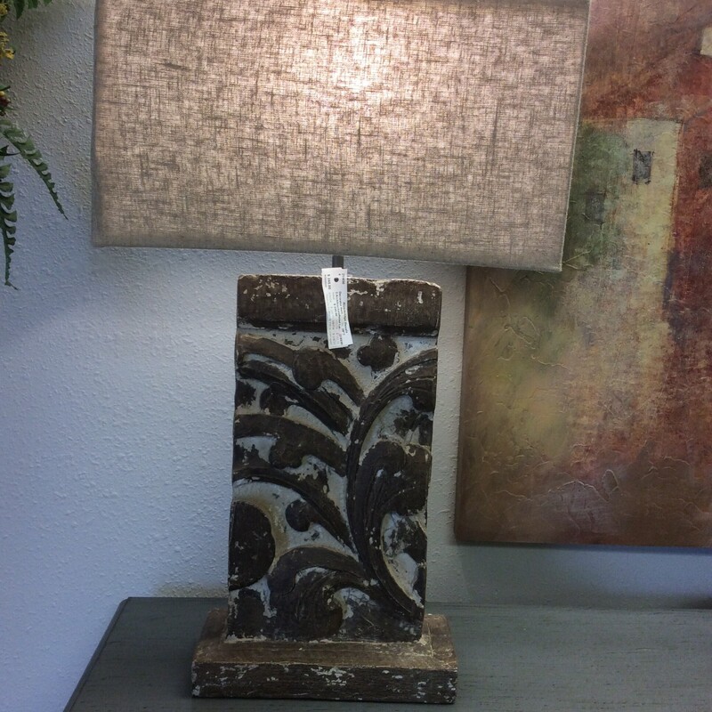 This pair of  ArchitcectureRelief lamps are made of wood with a textured shade