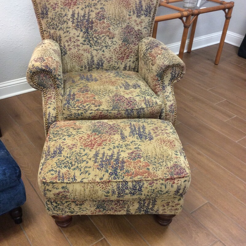 This Lazy  Boy Chair and Ottoman has a floral tapestry fabric with nail head trim.