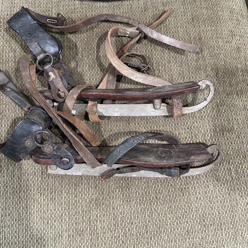 Ant. Hand Curled Skates
Hand forged curled skates with wooden base and leather straps.  These are hard to find in this condition and age.  One piece of leather is broken but the skates look like something Hans Brinker would have worn!