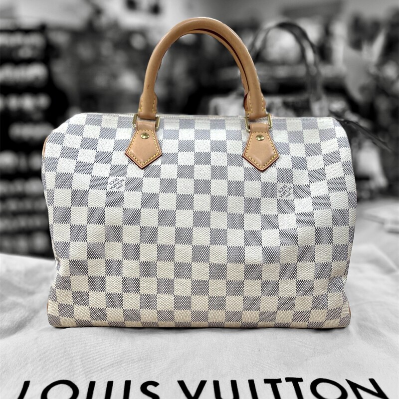 Authentic LOUIS VUITTON - SPEEDY 30
Fashioned from luminous Damier Azur canvas, the Speedy 30 is an elegant, compact handbag, a stylish companion for city life. Launched in 1930 as the \"Express\" and inspired by that era's rapid transit, today’s updated Speedy remains a timeless House icon, with its unmistakable silhouette, rolled leather handles and engraved, signature padlock.

SD2197 - indicates the bag was manufactured in France on 29th week of 2017

11.8 x 8.3 x 6.7 inches
(length x Height x Width)
Damier Azur coated canvas
Natural cowhide-leather trim
Textile lining
Gold-color hardware
Padlock
Inside zipped pocket
D-ring
Handle:Double
Comes with the Original Dust Cover
This bag retails $1550.00 Brand New.
This bag is in great preowned condition, very minor wear.  Leather has not even started tanning yet.
If you go online to Louis Vuitton you will find this bag is currently out of stock.