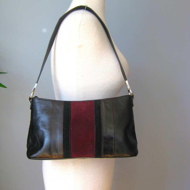 Vtg Etienne Aigner Shldr, Blk/burg, Size: None<br />
Handsome Etienne Aigner handbag in black leather with a wide burgundy suede stripe on the front.<br />
Silver hardware<br />
Central zippered pocket and two full size side pockets<br />
Inside there is one zippered pocket and one slip<br />
Great condition but the edge of the straps has some cracks as shown.<br />
<br />
Measurements:<br />
Width: 12<br />
Height: 7<br />
Depth: 3 1/2<br />
Handle Drop: 11.25<br />
<br />
Thanks for looking!<br />
#71947