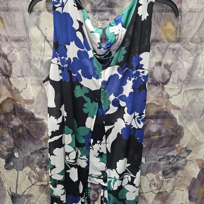 Super cute layered sleeveless blouse in a bold pattern.