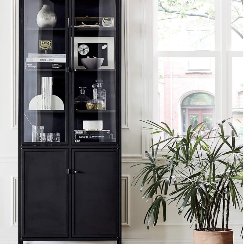 Metal Cabinet

Size: 83Hx31Wx16

Inspired by the clean lines of vintage French casement windows, Casement stores and displays behind clear glass doors that latch with simple industrial hardware. The collection's streamlined steel design can pair with traditional to more modern furniture.
Designed by Paul Schulman of Schulman Design, this simply styled tall cabinet offers concealed storage below with adjustable shelves and a top ledge to showcase prized pieces. The Casement Tall Cabinet is a Crate and Barrel exclusive.


Casement Black Tall Cabinet 31.5Wx16Dx83H










Designed by Paul Schulman of Schulman Design
Steel with powdercoat finish
2 steel bottom doors and 2 glass top doors
4 adjustable metal shelves
4 levelers on base