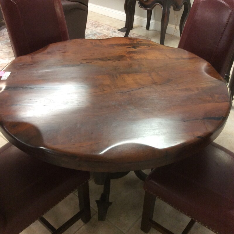 Beautiful custom made Mesquite Table with a iron base. Size: 48D X 30H