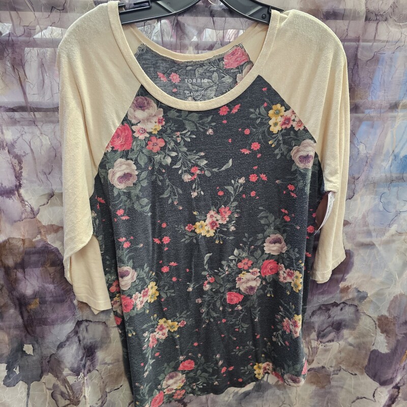 Half sleeve baseball style tee in tan and black with floral print.