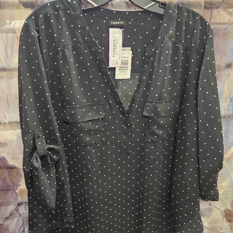 Brand new with tags, black blouse with white polka dots. Retails for $45